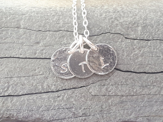 Family initial necklace in sterling silver.