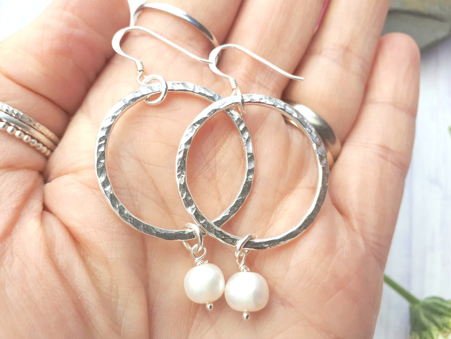 Pearl hoop earrings in sterling silver.