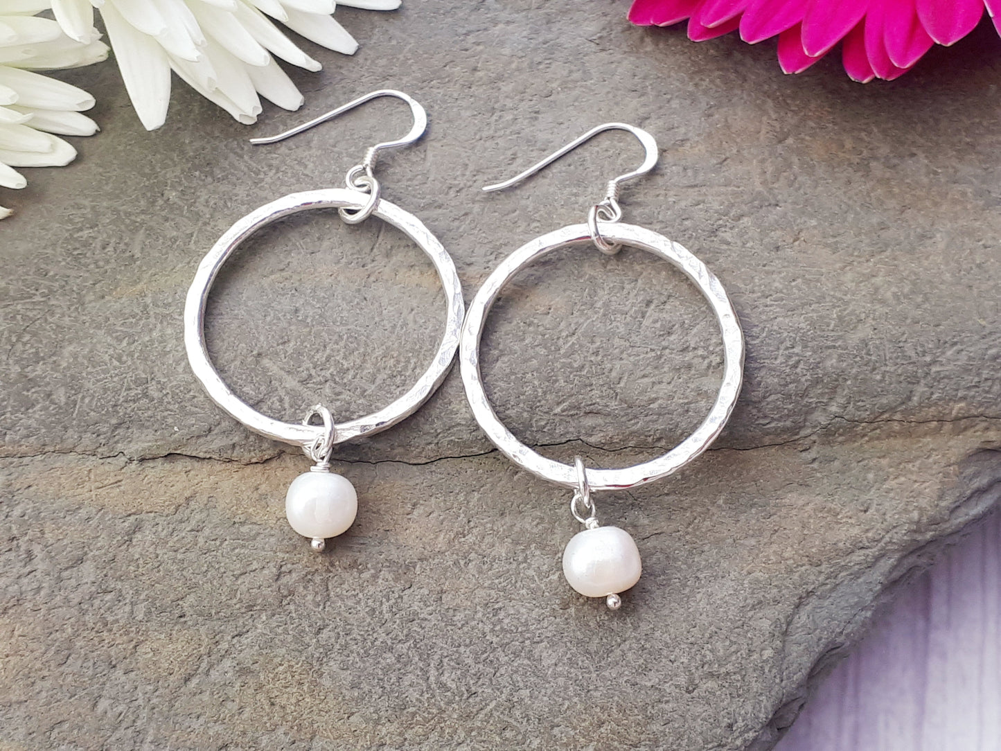 Pearl hoop earrings in sterling silver.