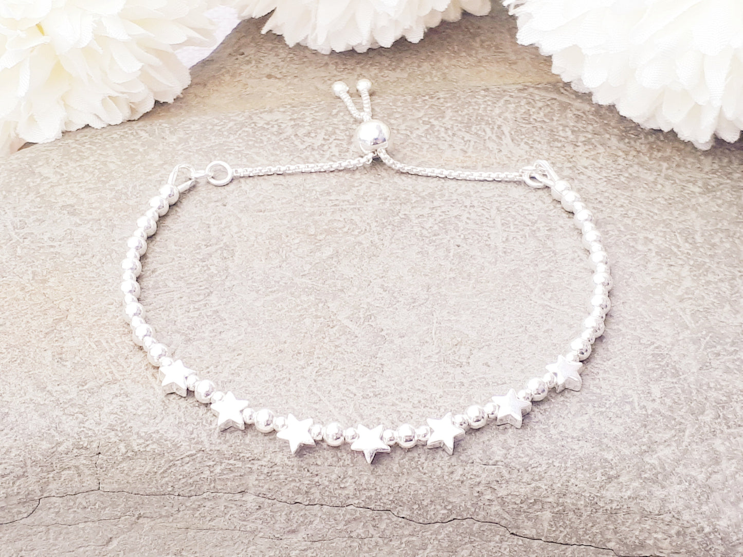 70th birthday bracelet. 70th birthday gift. Sterling silver star bracelet with slider clasp.