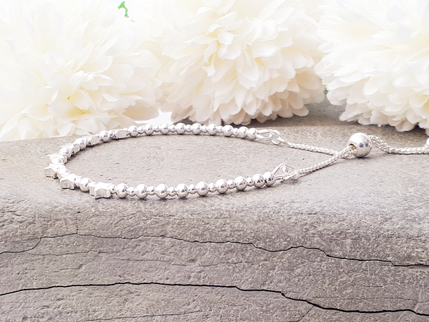 70th birthday bracelet. 70th birthday gift. Sterling silver star bracelet with slider clasp.