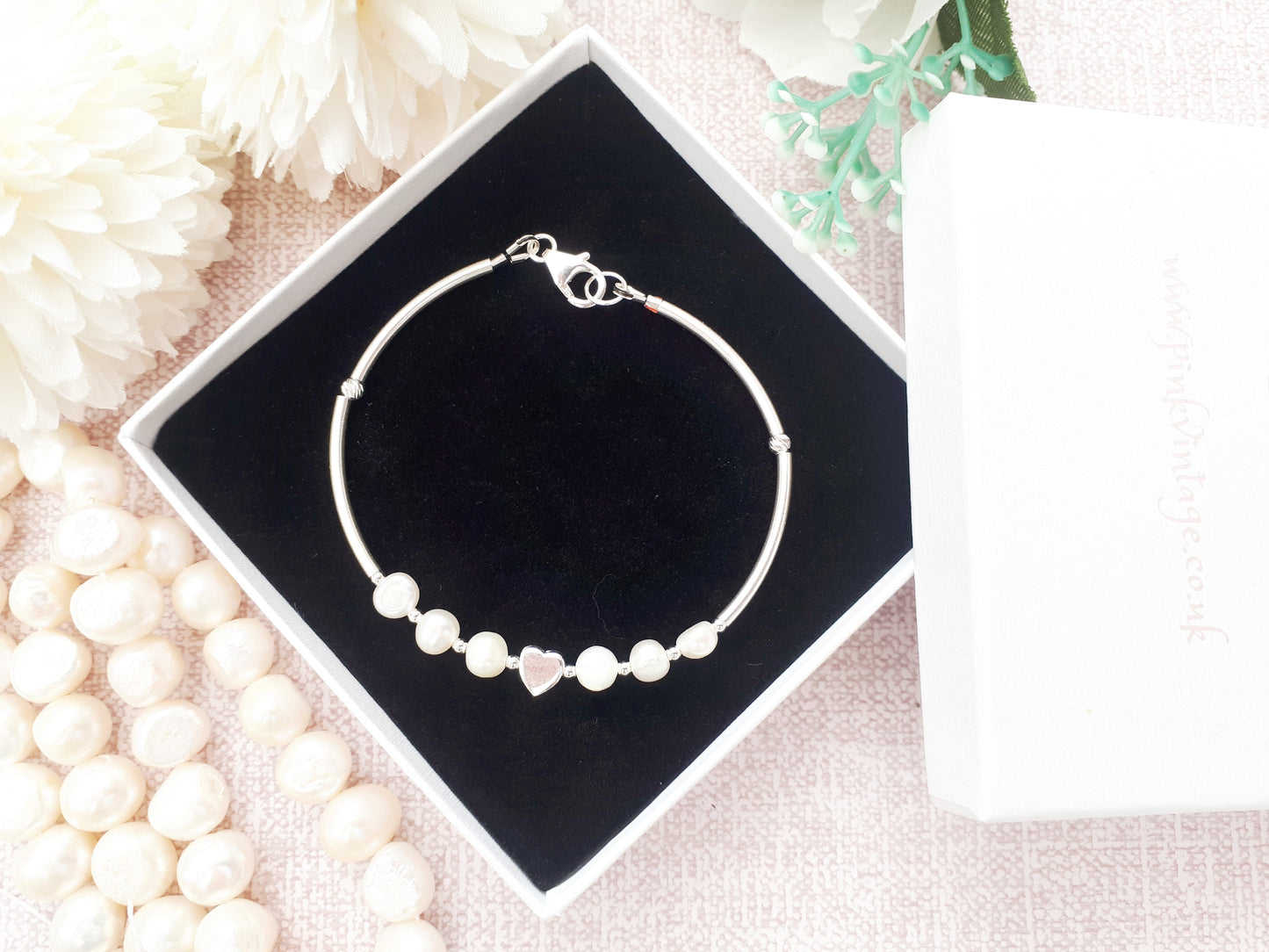 Personalised pearl bracelet in sterling silver.