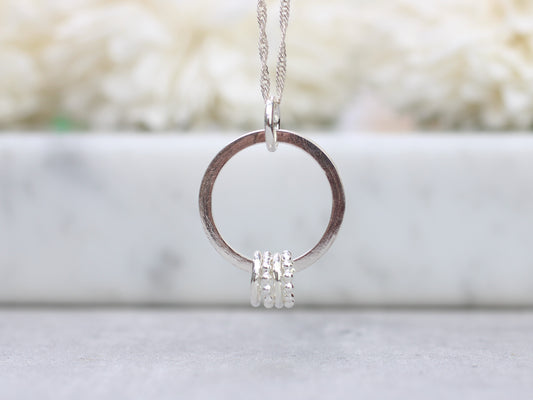 40th birthday necklace with 4 rings.