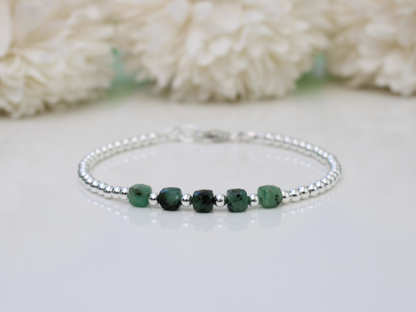 Emerald milestone bracelet in silver.