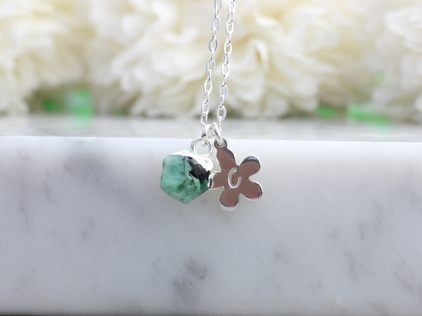 Personalised emerald necklace in silver.