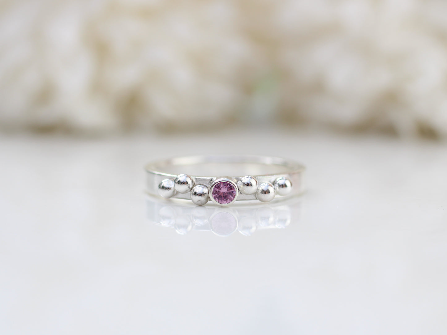 Pink sapphire and granulation ring. September birthstone.