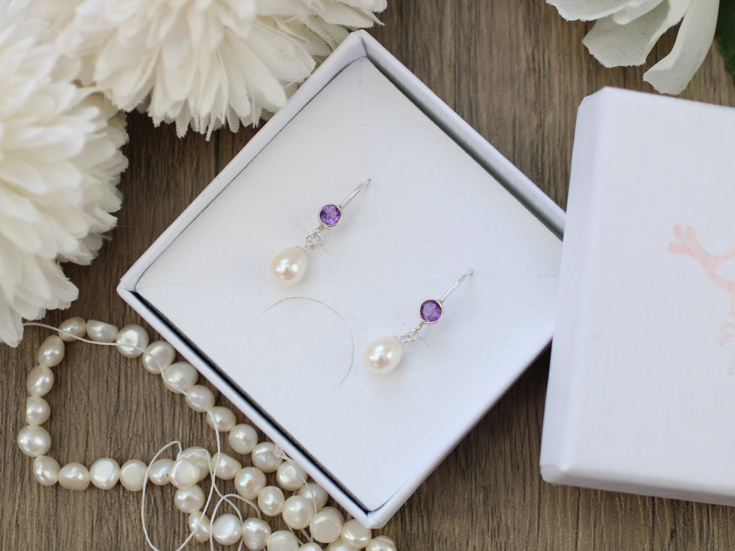 Amethyst and pearl drop earrings.