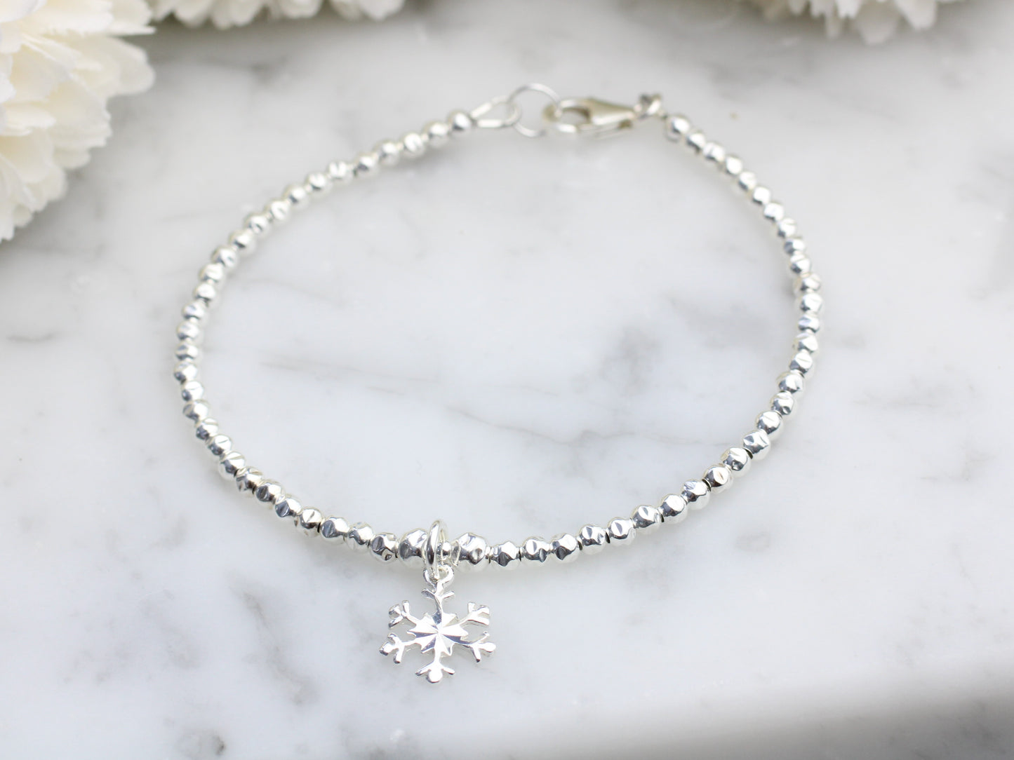 Snowflake charm bracelet.