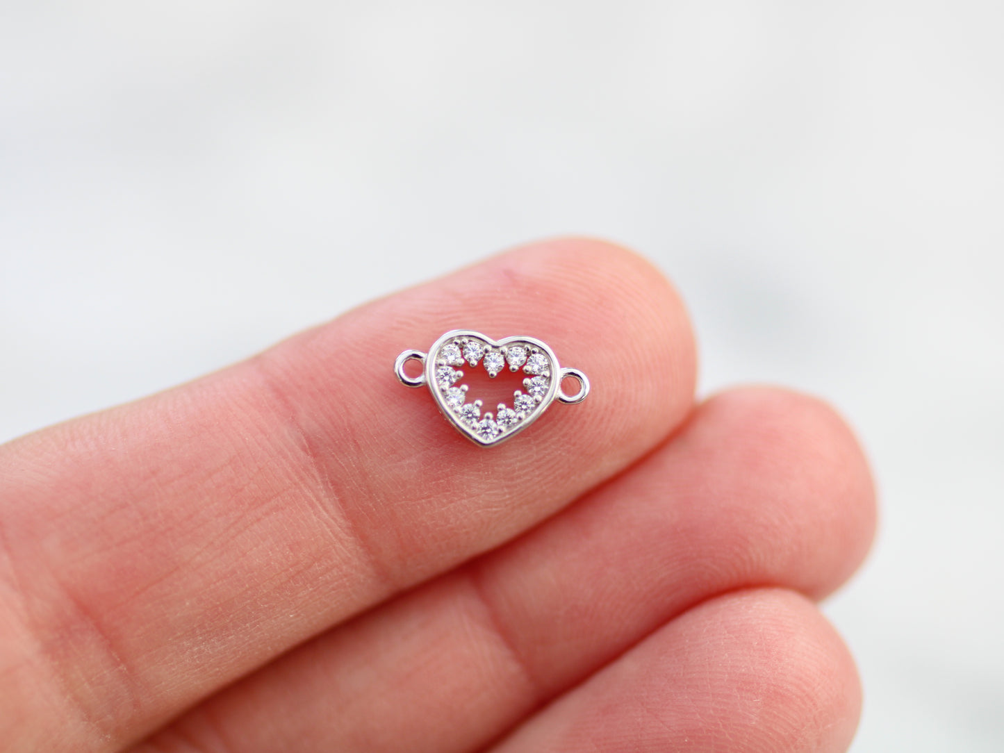 Crystal heart connector in sterling silver.