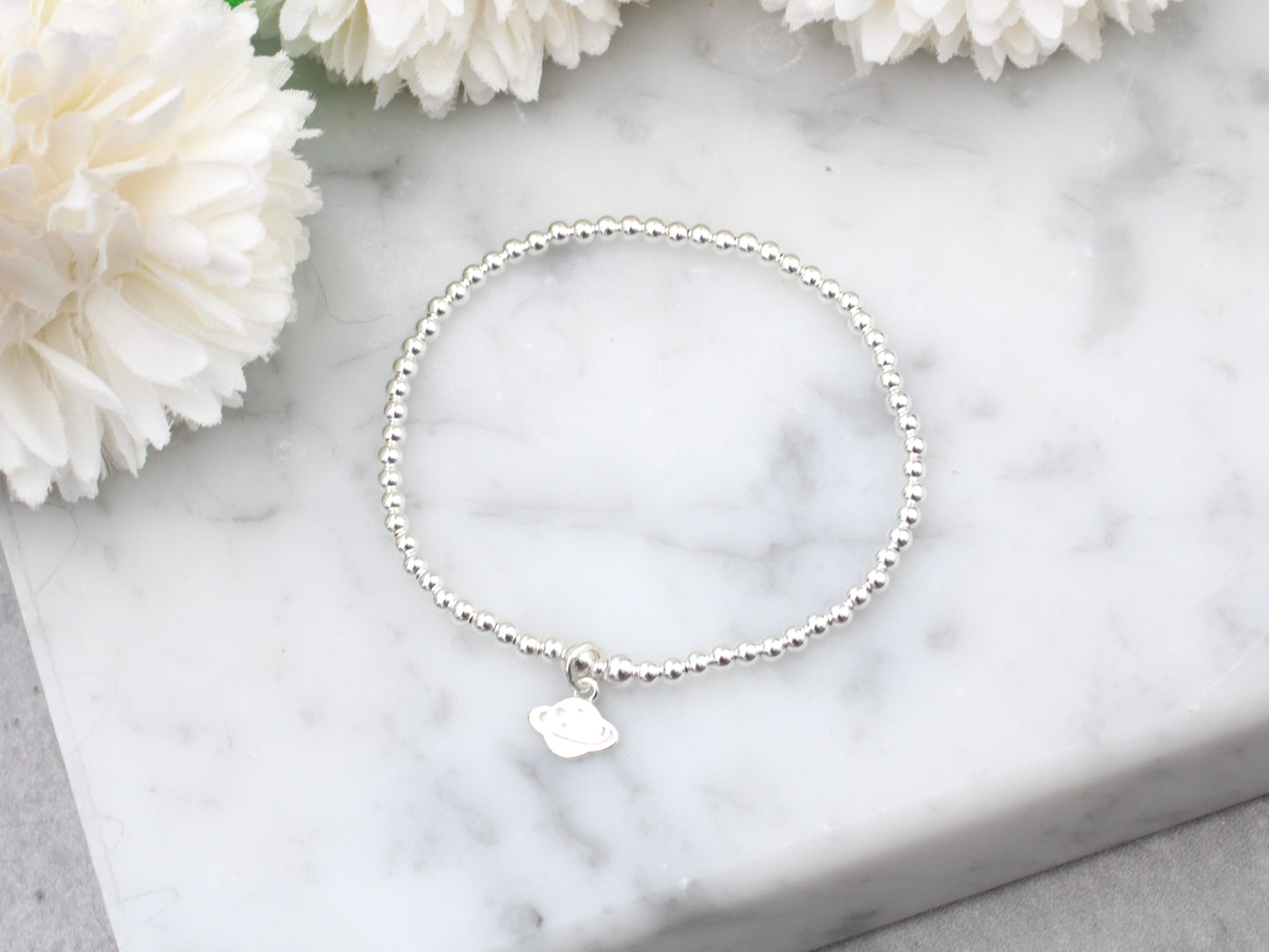 Planet charm bracelet.