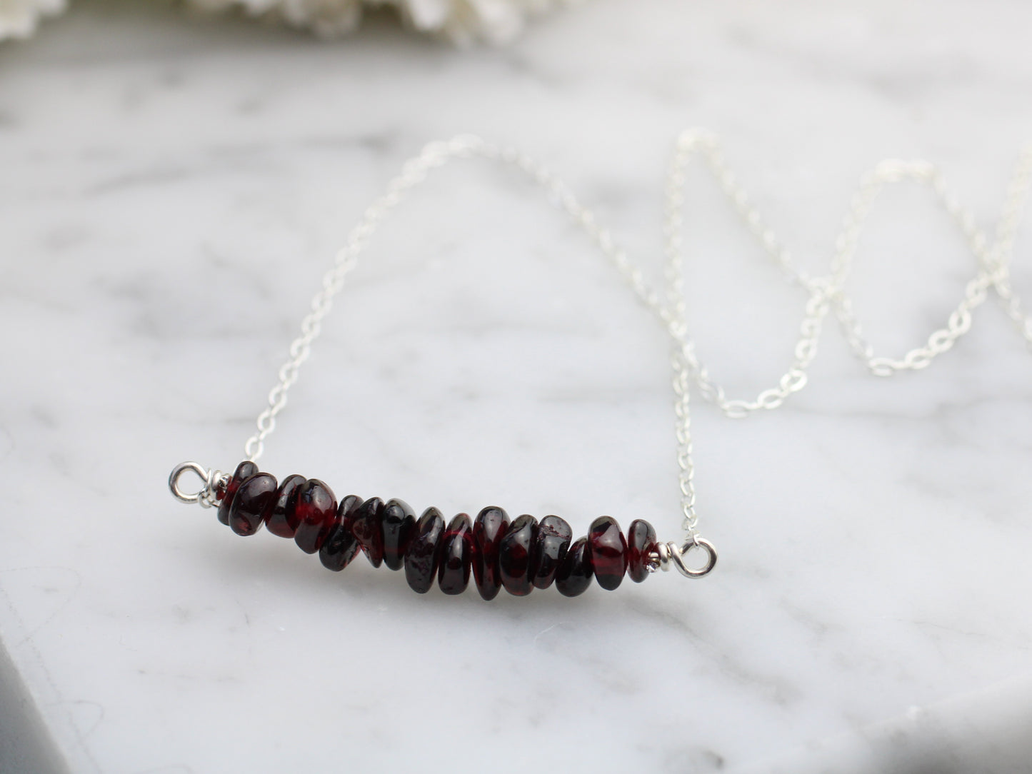 Garnet gemstone necklace in sterling silver.