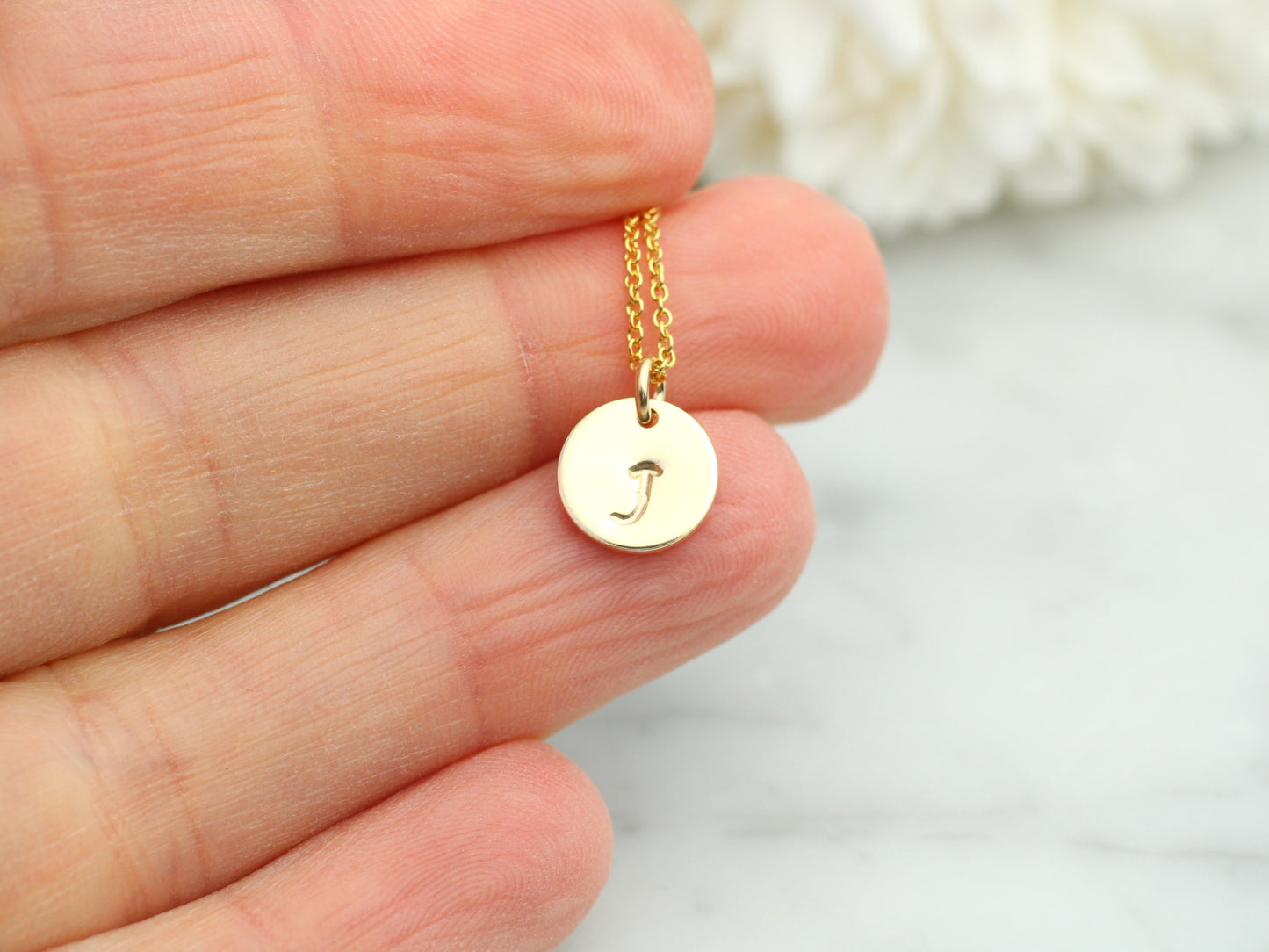 Initial necklace in gold. Choose up to 4 tags.