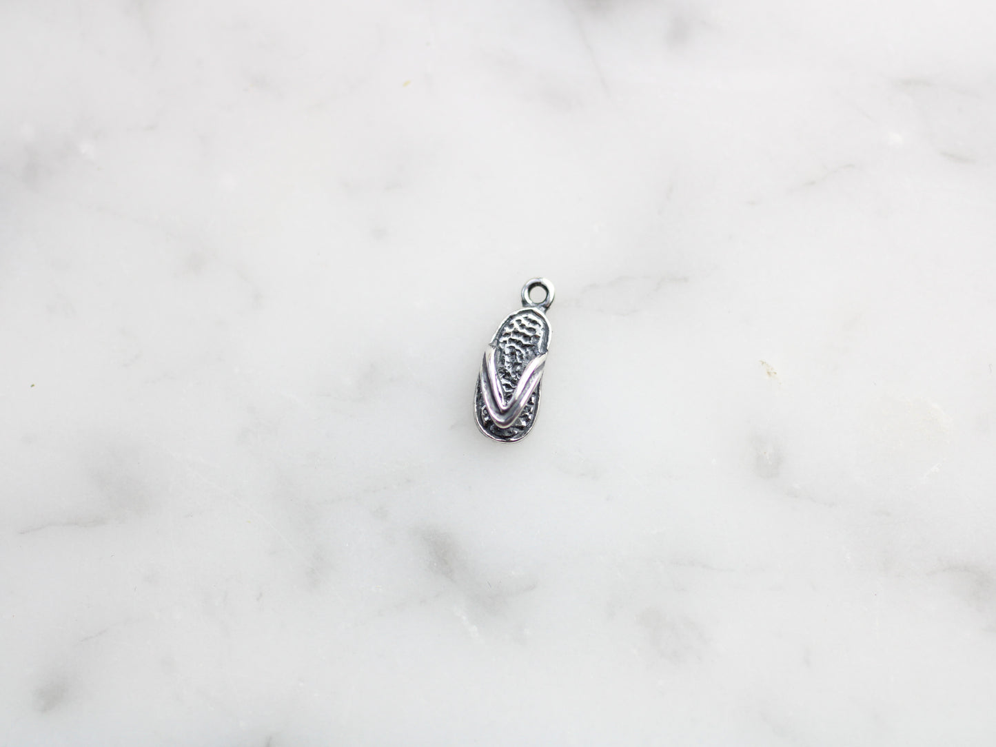 Flip-flop charm.
