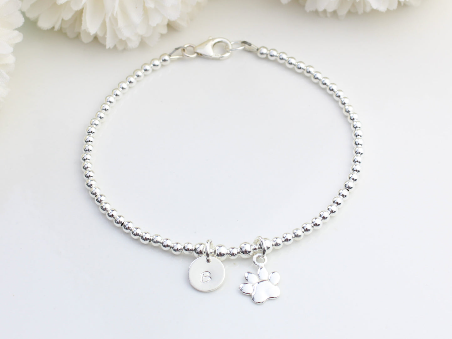 Paw print and initial charm bracelet.
