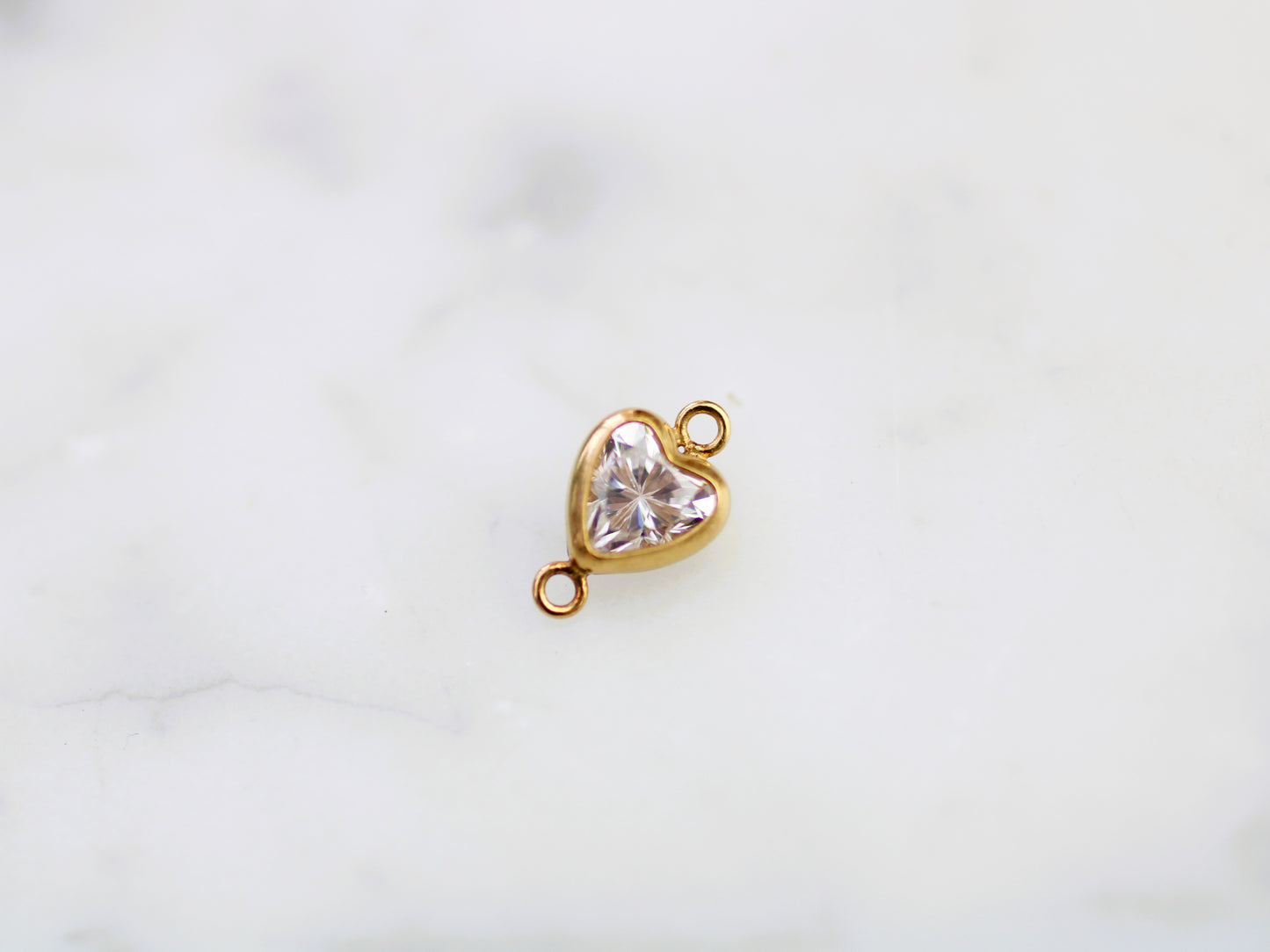 Gold filled 5 mm crystal heart connector.