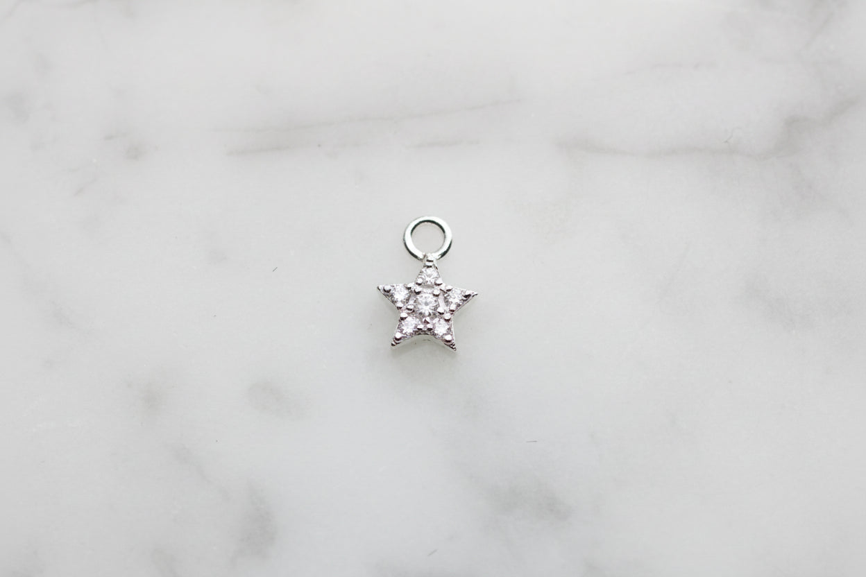 Mini sparkly star charm.