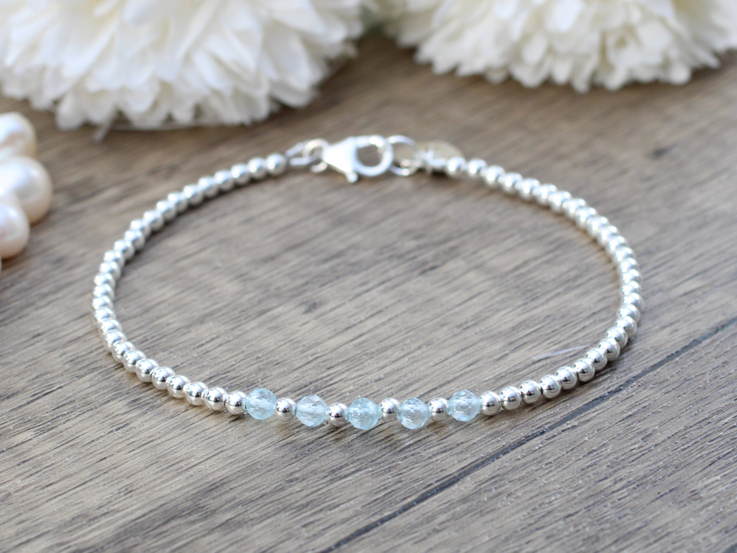 Blue topaz milestone bracelet in silver.