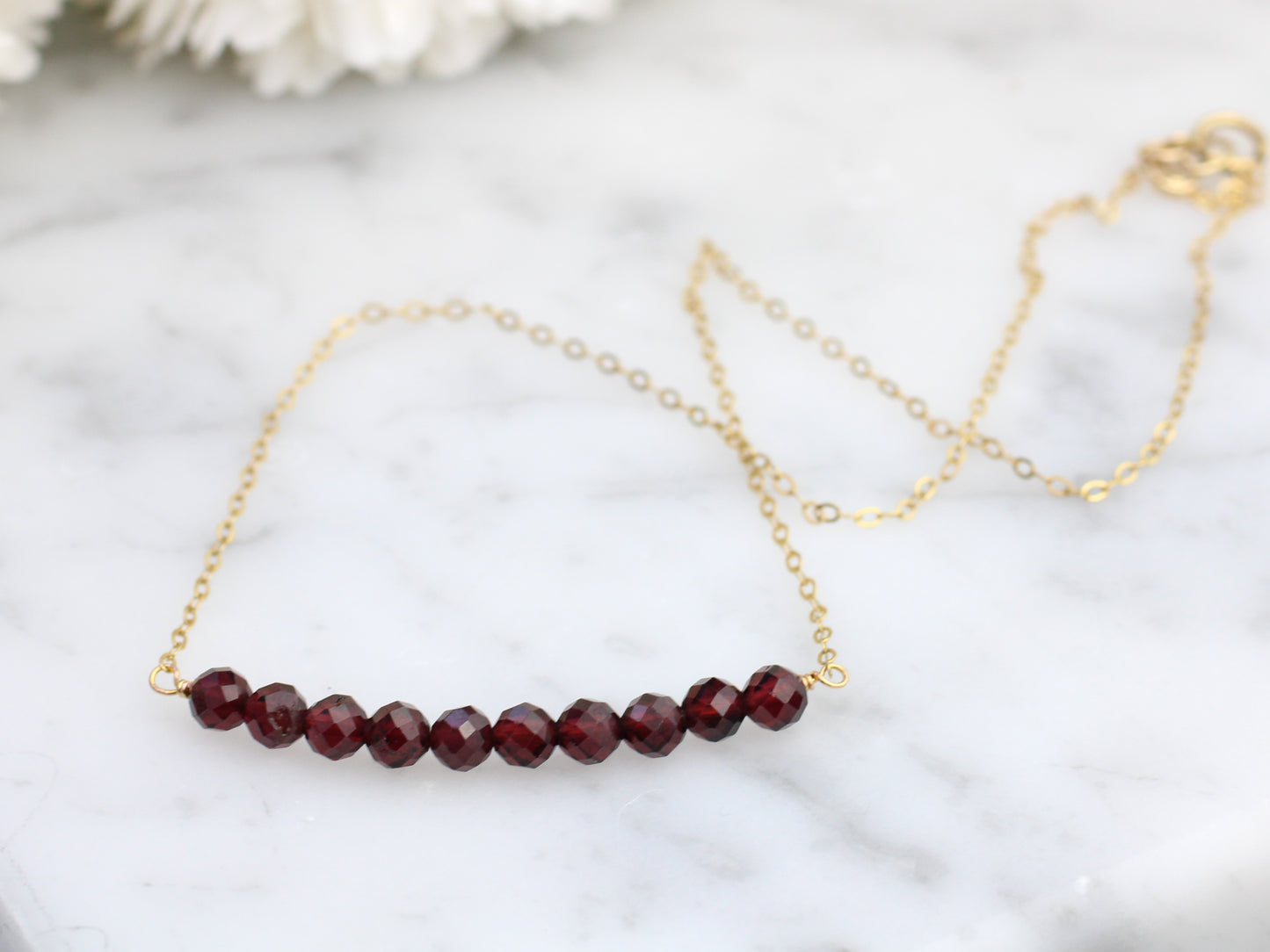 Garnet gemstone necklace in sterling silver or gold.
