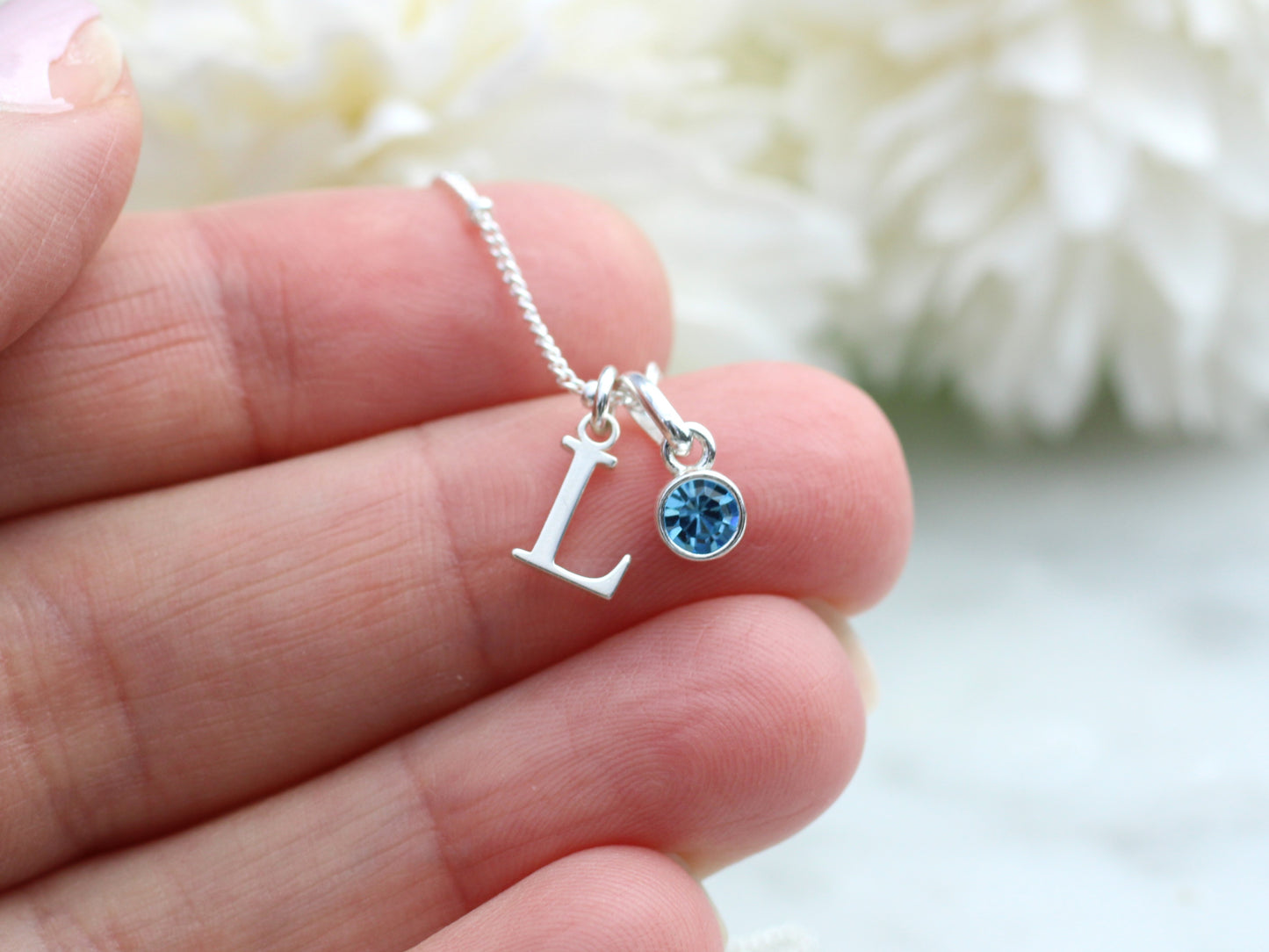 Initial and birthstone necklace.