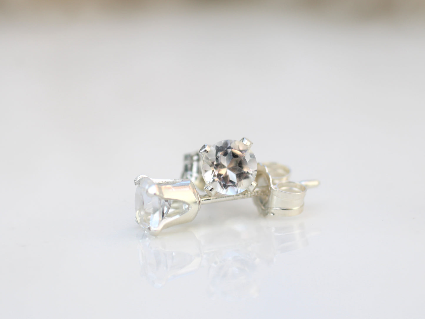 Clear quartz stud earrings in sterling silver or gold.