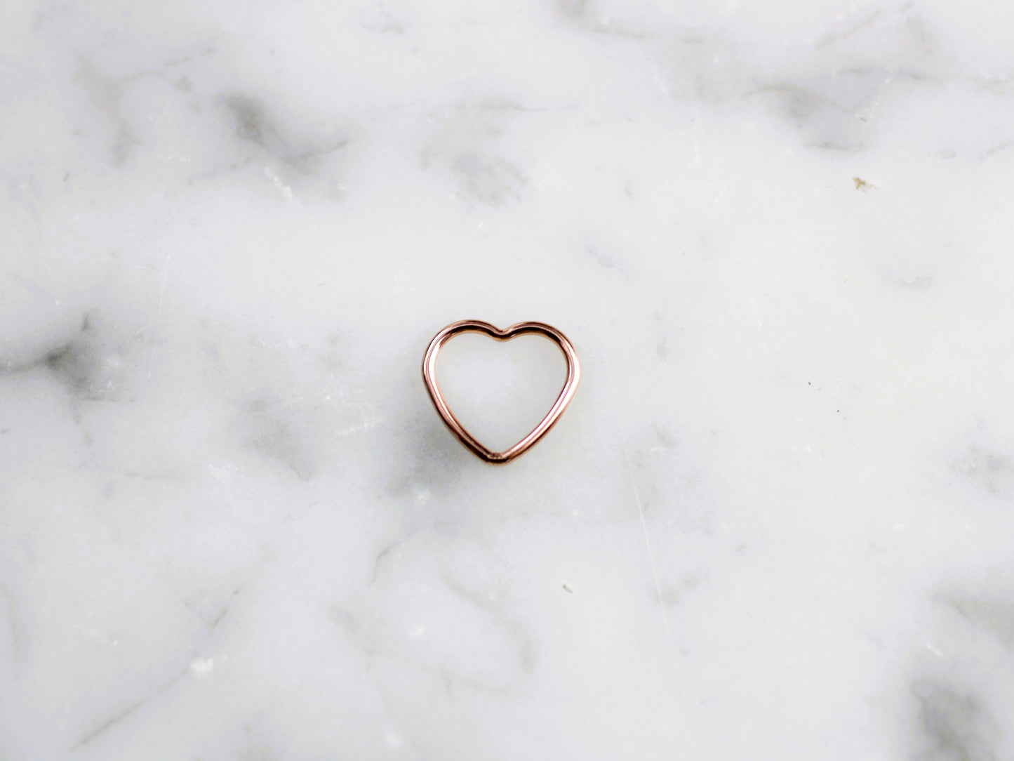 Rose gold heart connector.