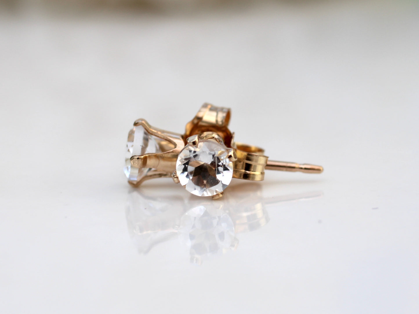 Clear quartz stud earrings in sterling silver or gold.