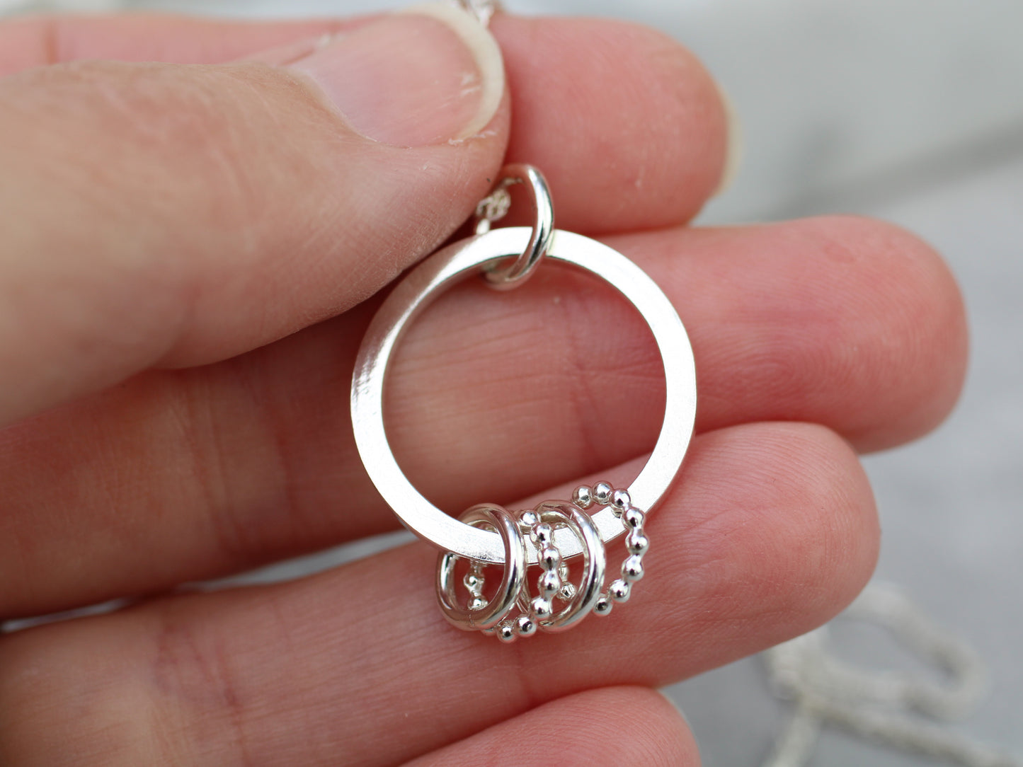40th birthday necklace with 4 rings.