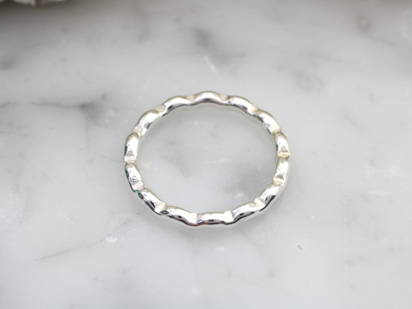 Wavy ring made from recycled sterling silver.
