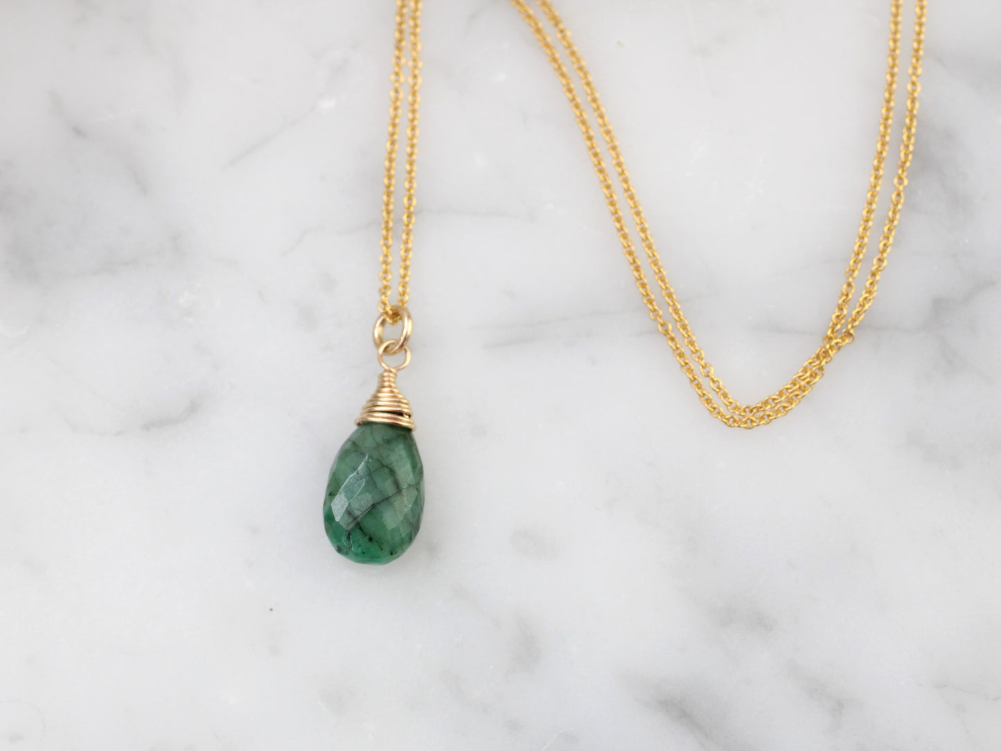 Emerald necklace in silver or gold.