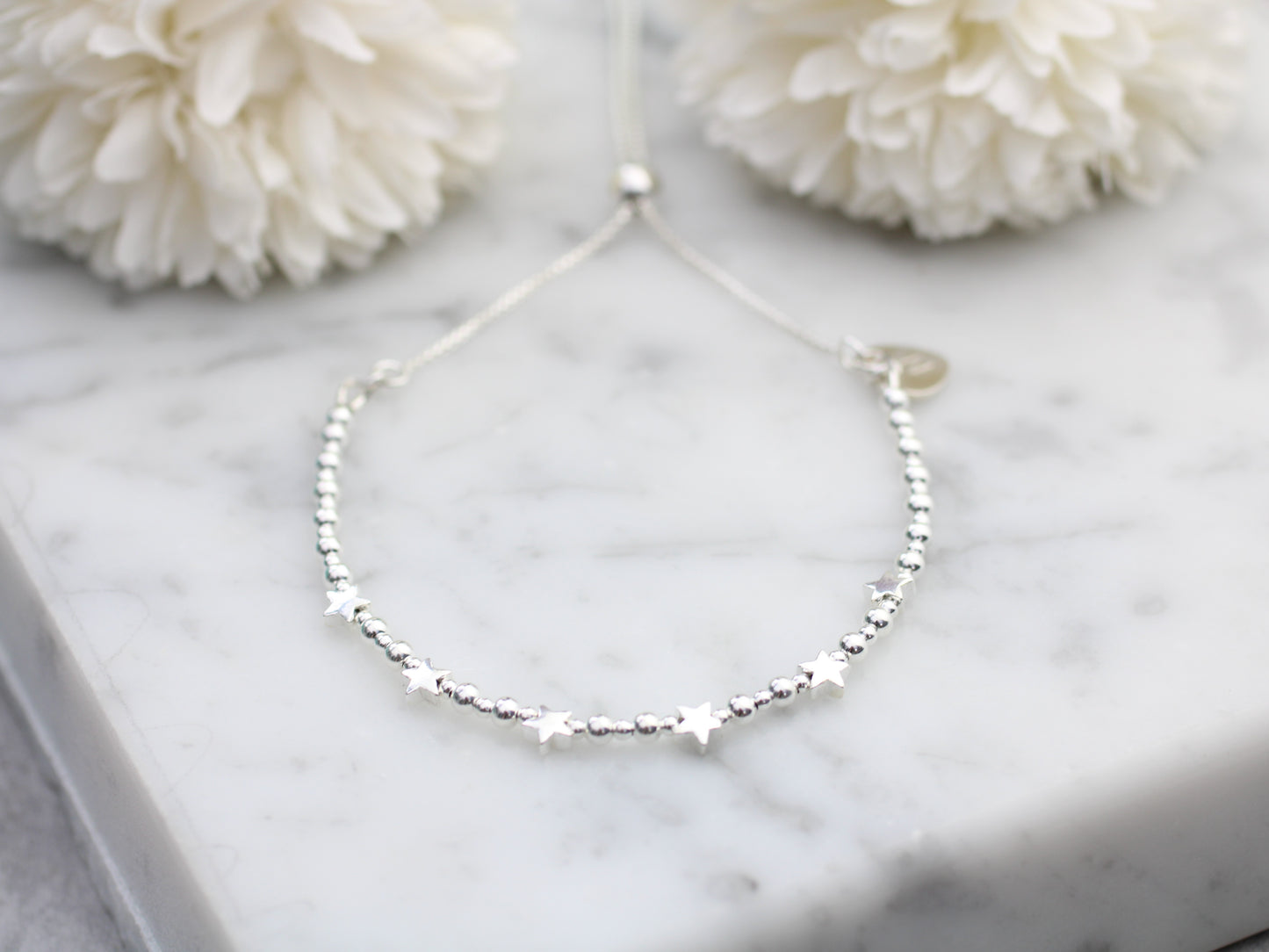 60th birthday bracelet. 60th birthday gift. Sterling silver star bracelet with slider clasp.
