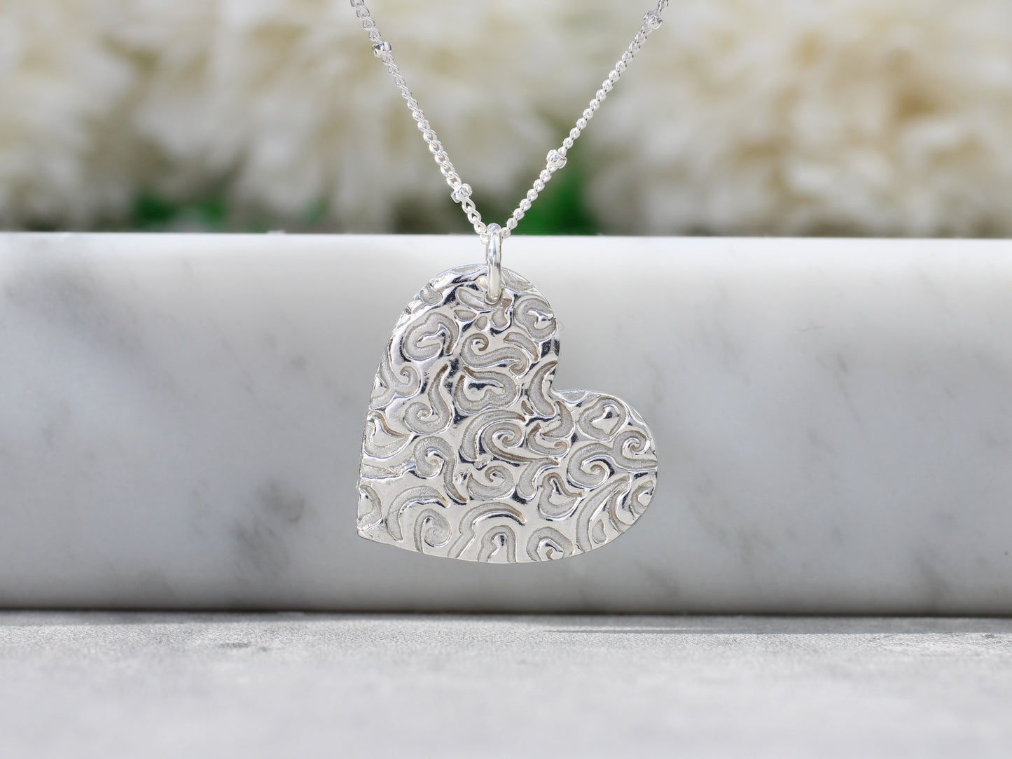 Pure silver heart pendant necklace.