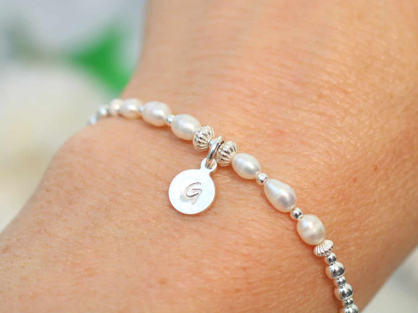 Freshwater pearl initial bracelet.