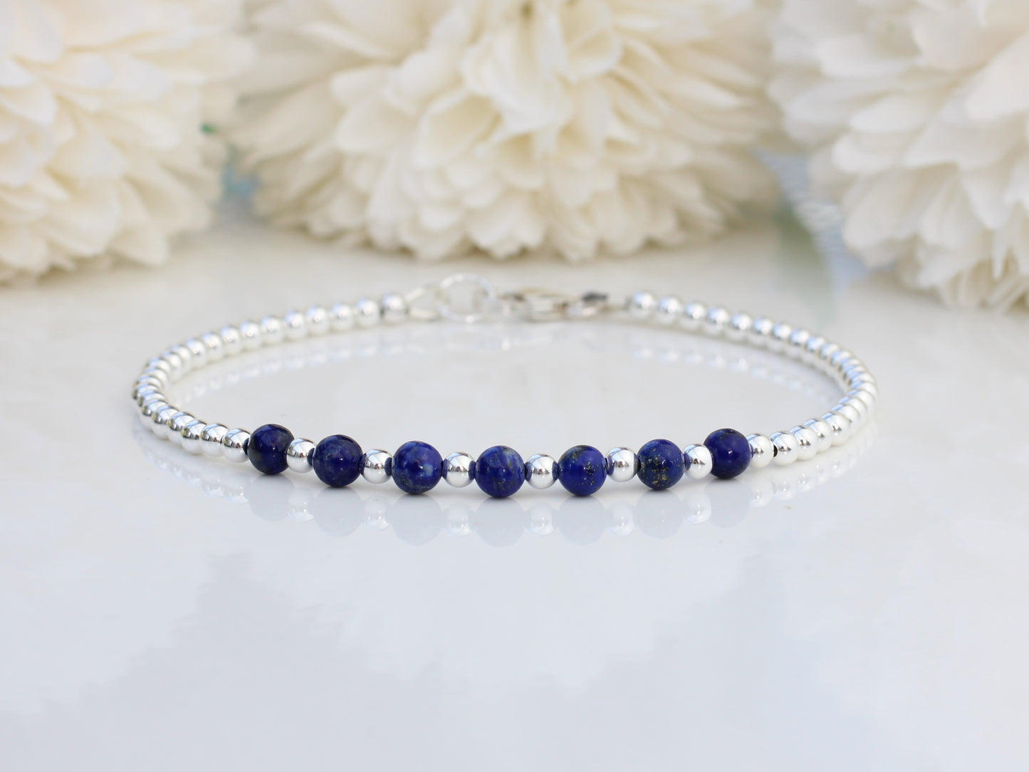 Lapis lazuli milestone bracelet in sterling silver.