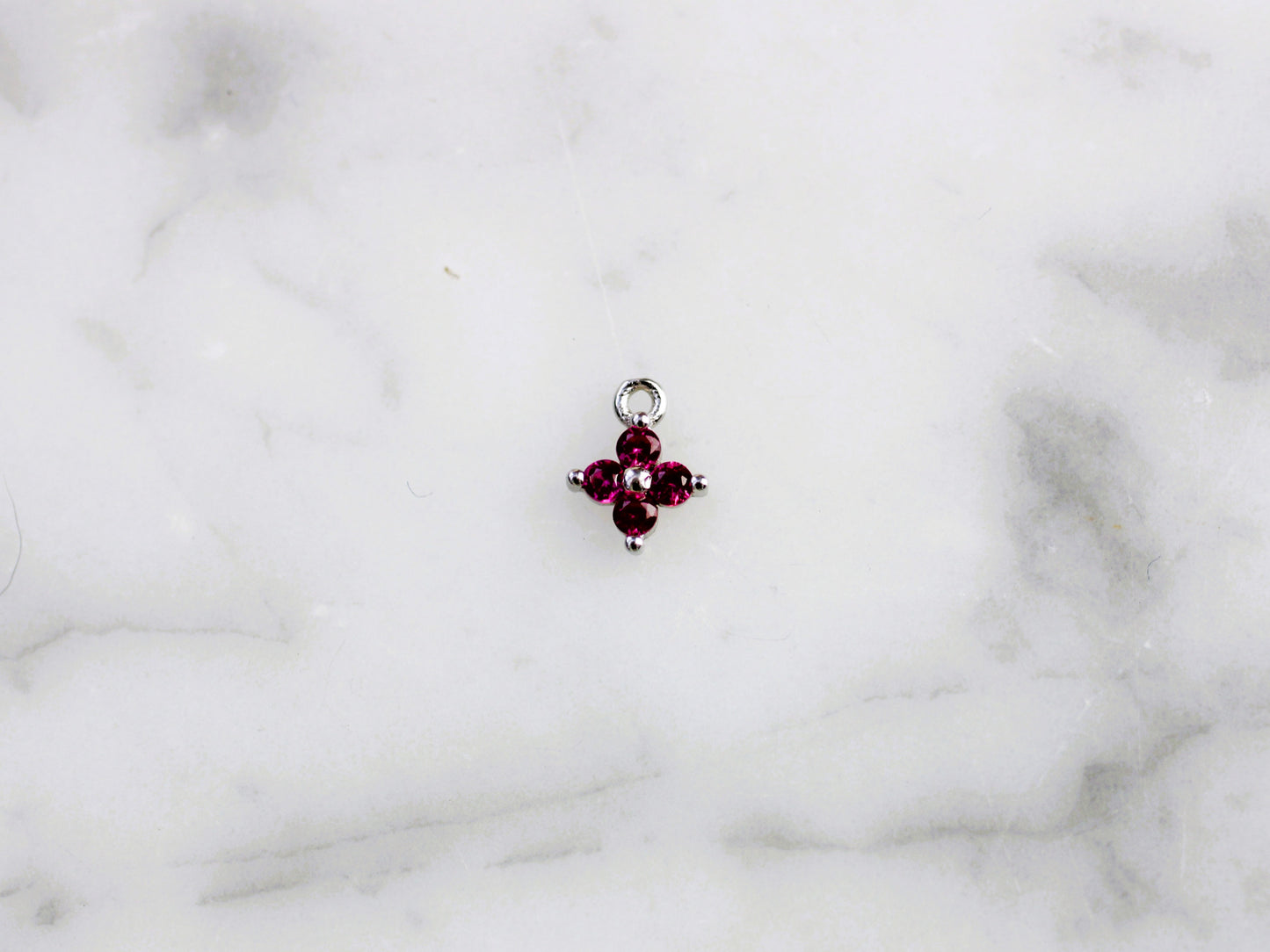 Pink flower charm.