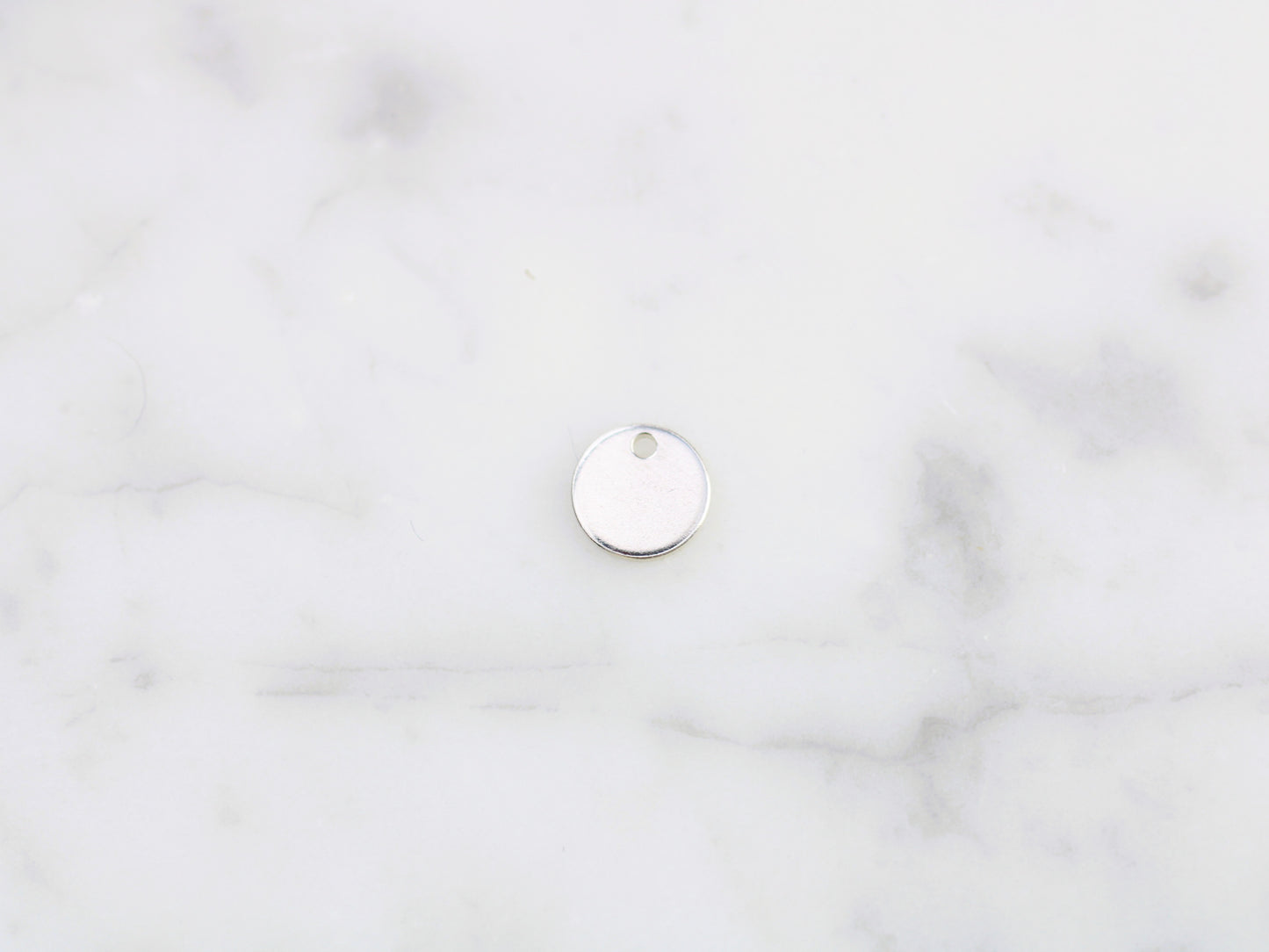 Personalised round charm.