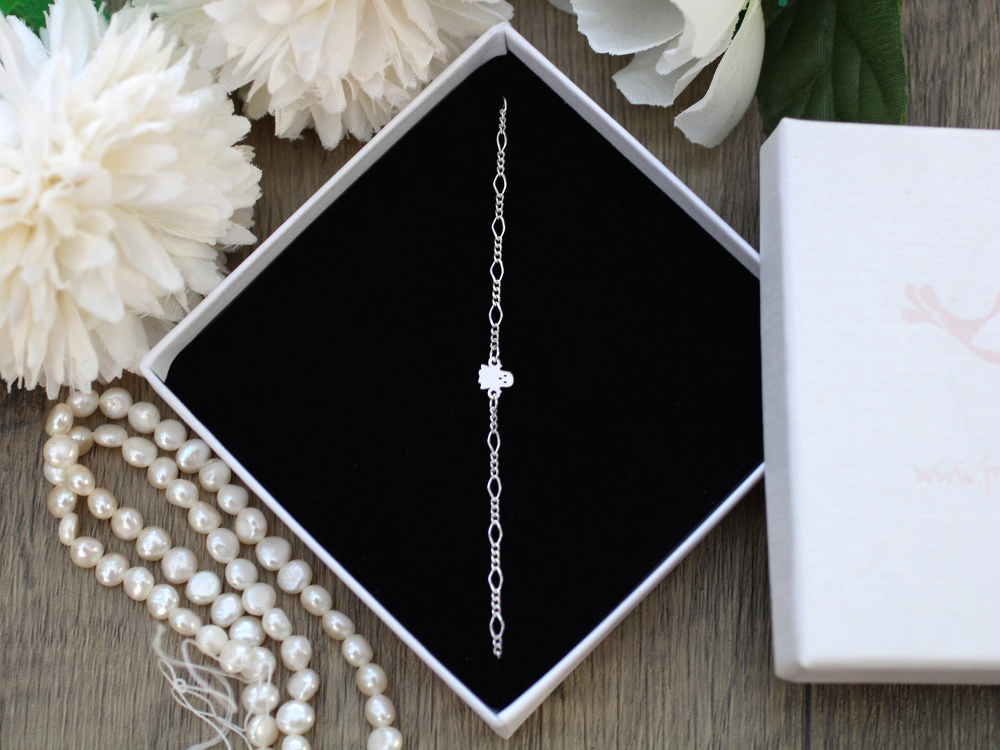 Dainty ghost bracelet in silver or gold.