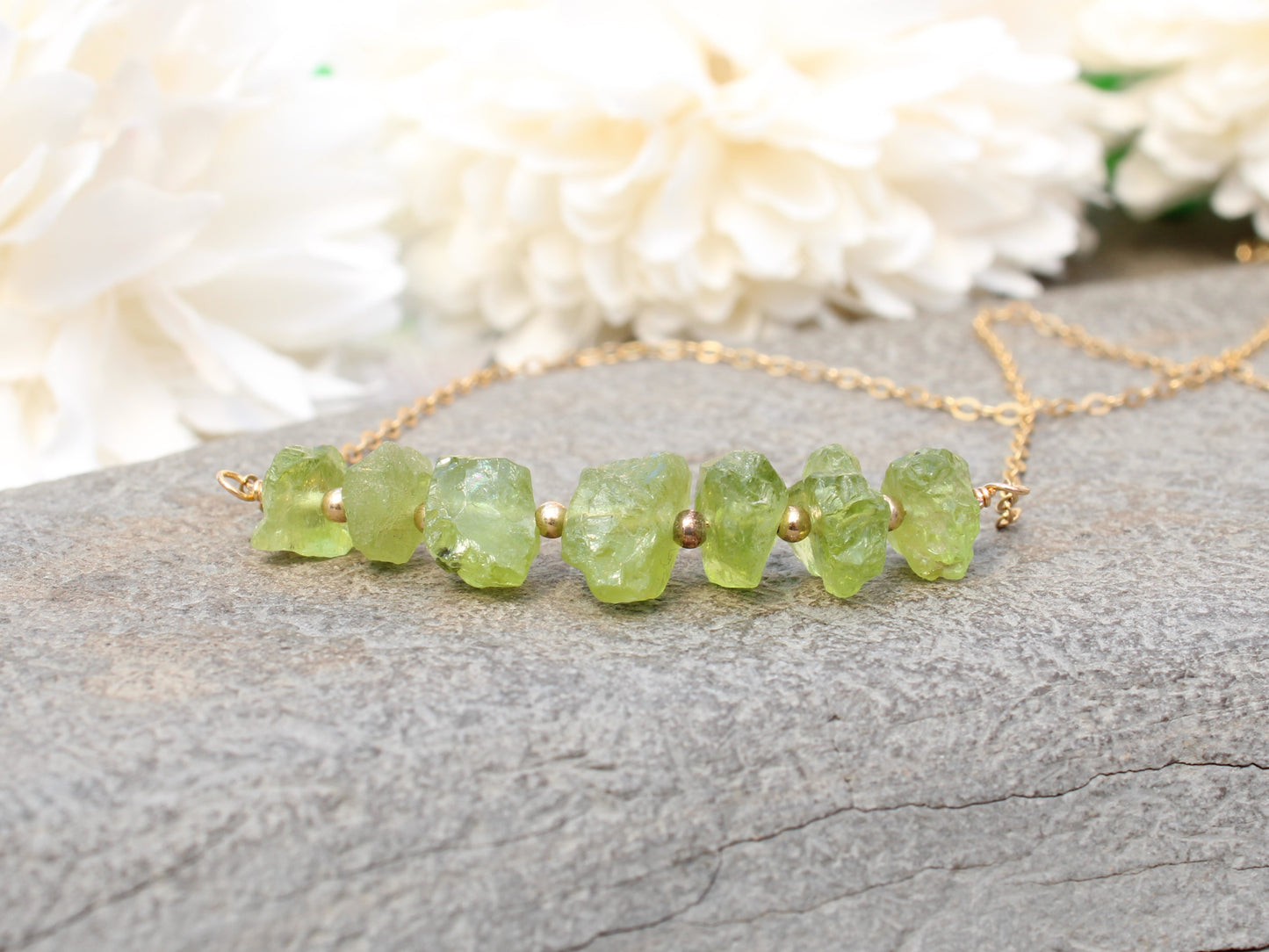 Raw peridot necklace in sterling silver or gold.