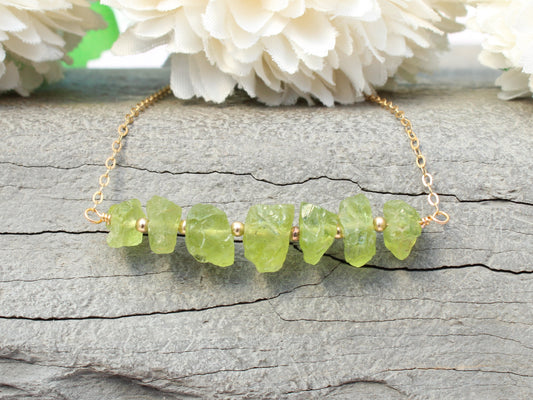 Raw peridot necklace in sterling silver or gold.