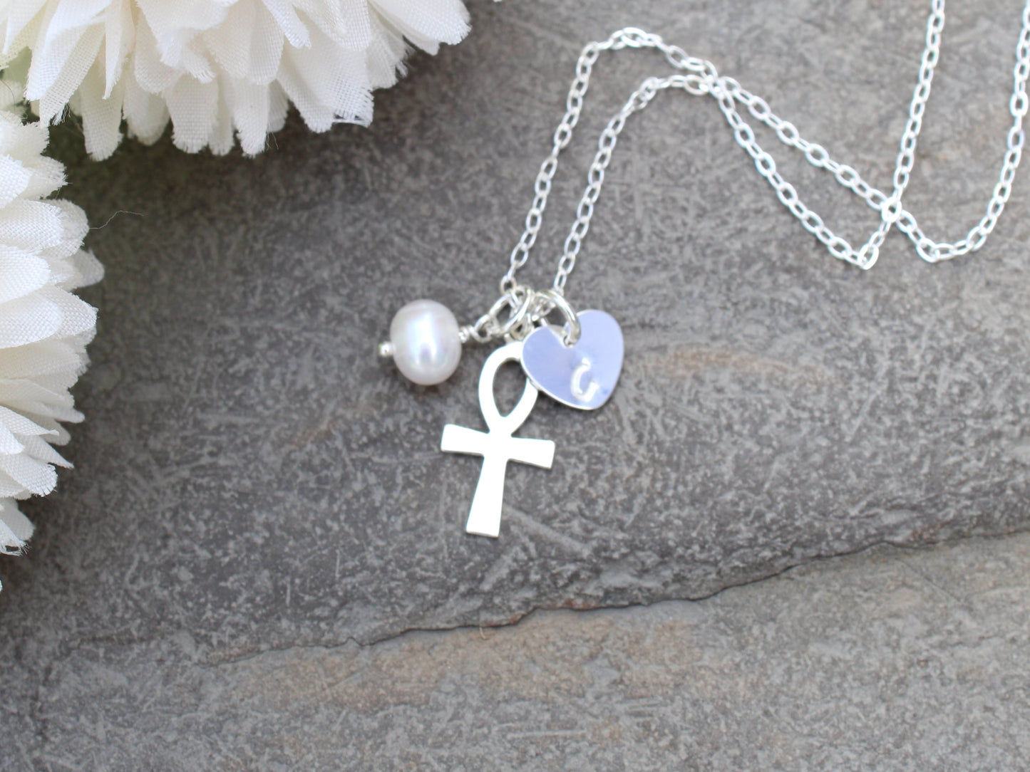 Personalised silver ankh cross necklace.