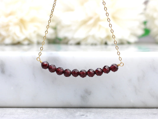 Garnet gemstone necklace in sterling silver or gold.