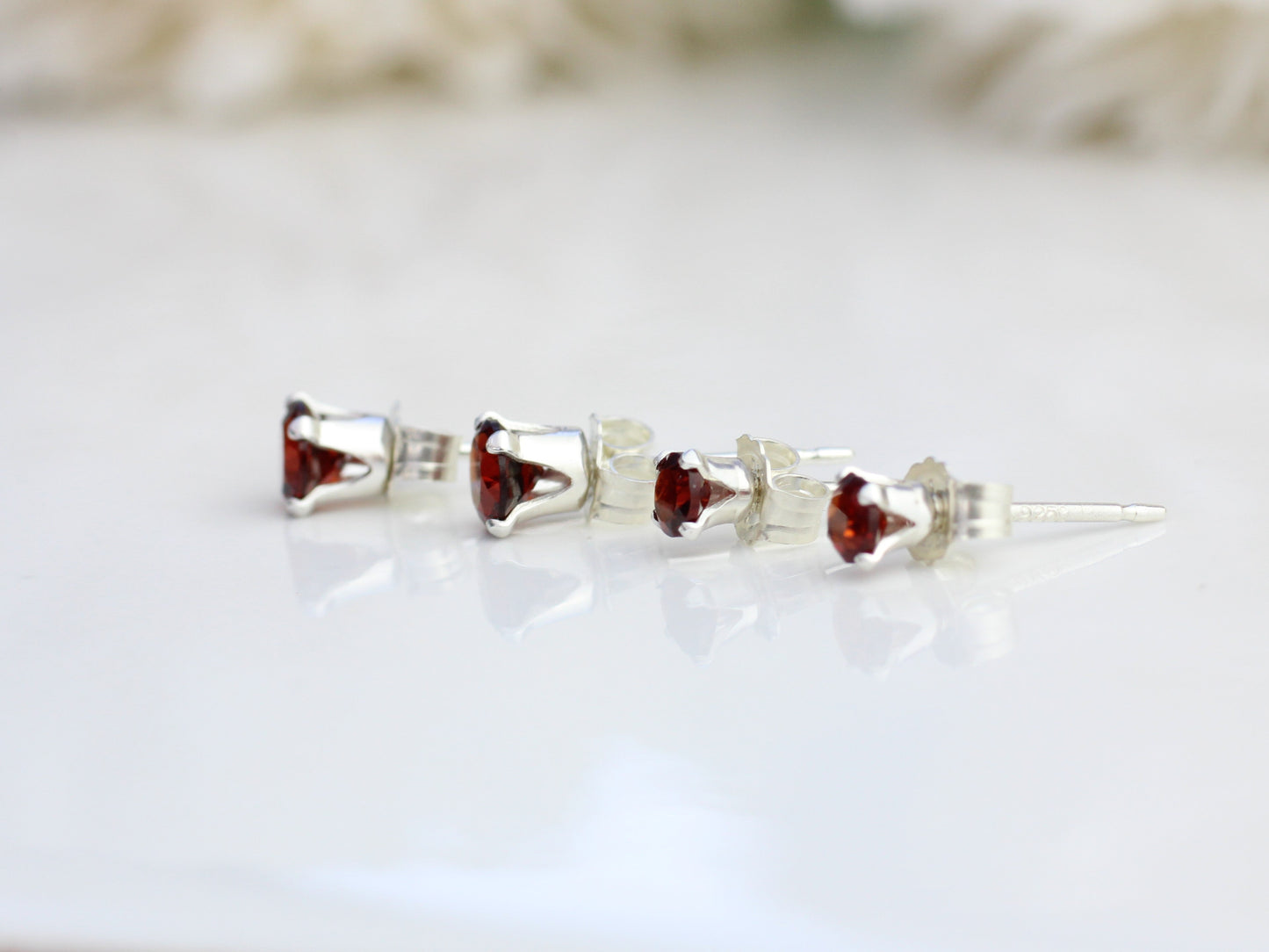 Garnet stud earrings. January birthstone earrings.