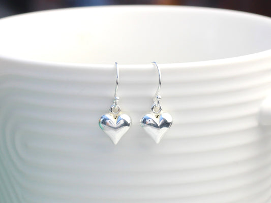 Heart drop earrings in sterling silver.