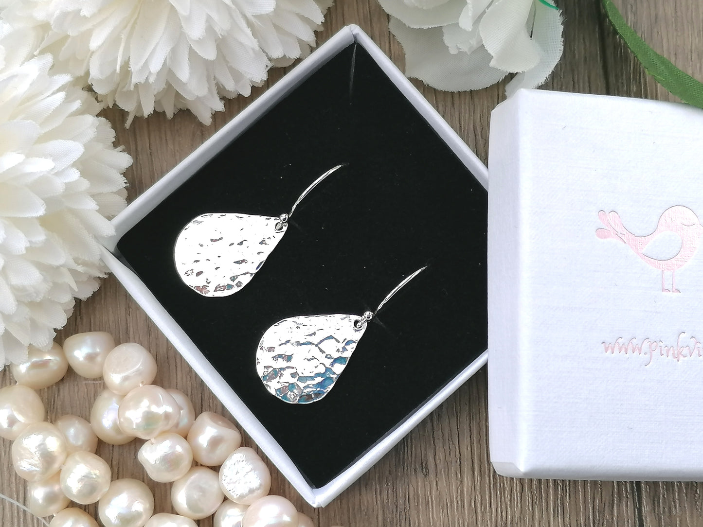 Hammered teardrop earrings in sterling silver.