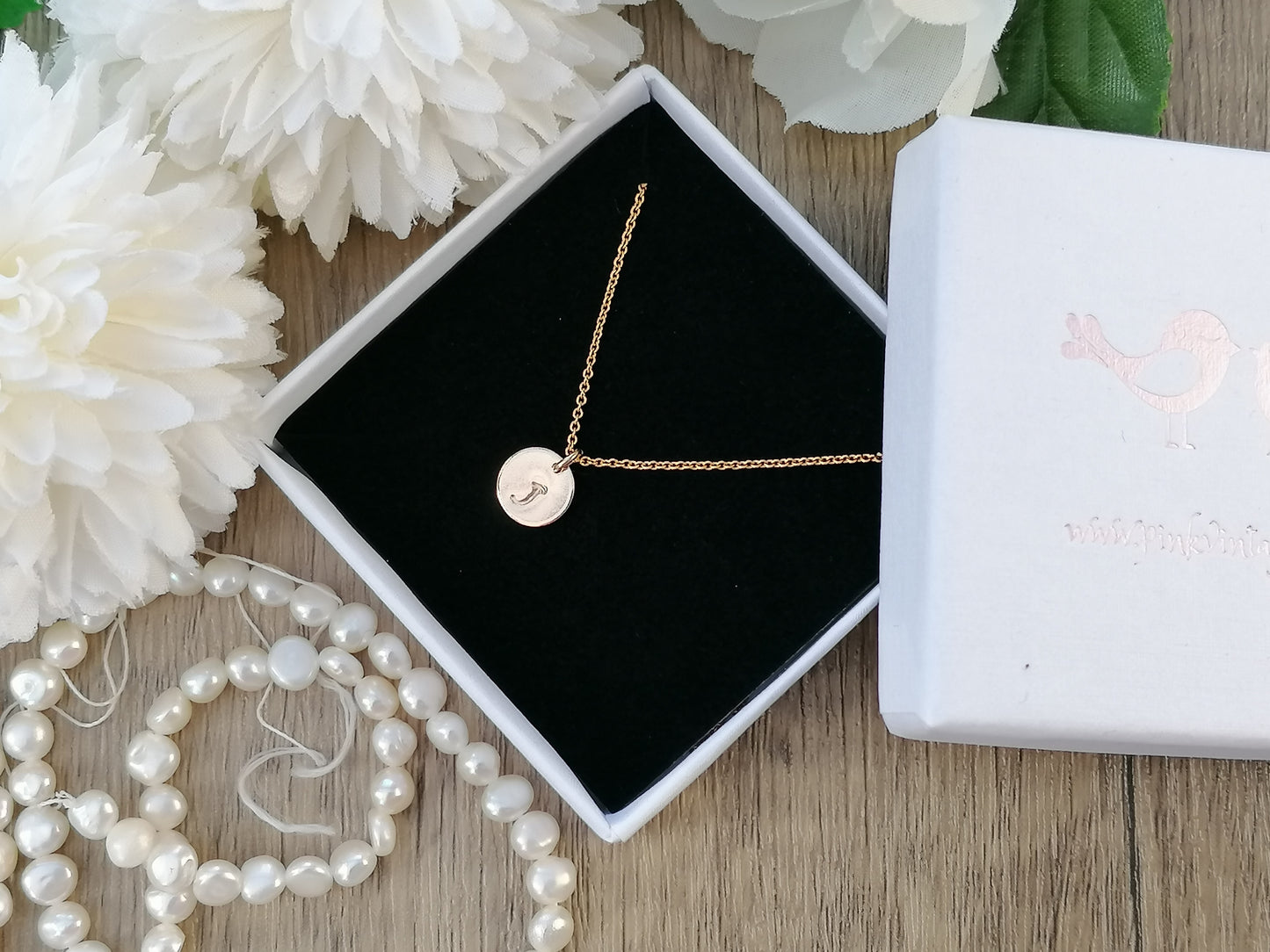 Initial necklace in gold. Choose up to 4 tags.