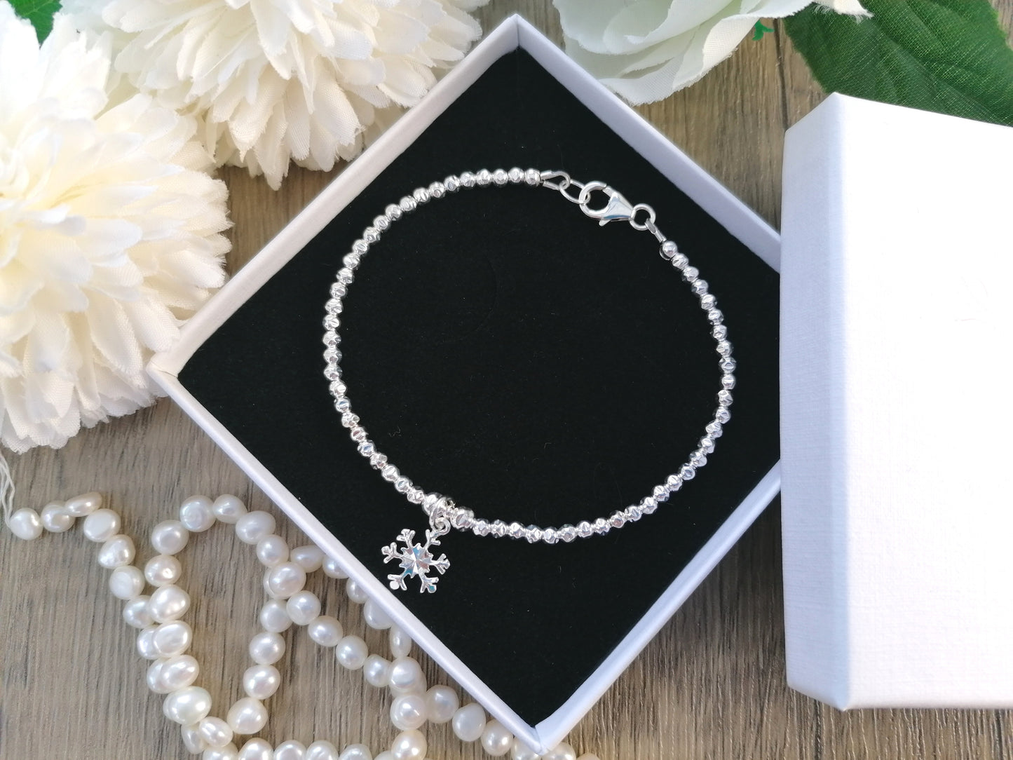 Snowflake charm bracelet.