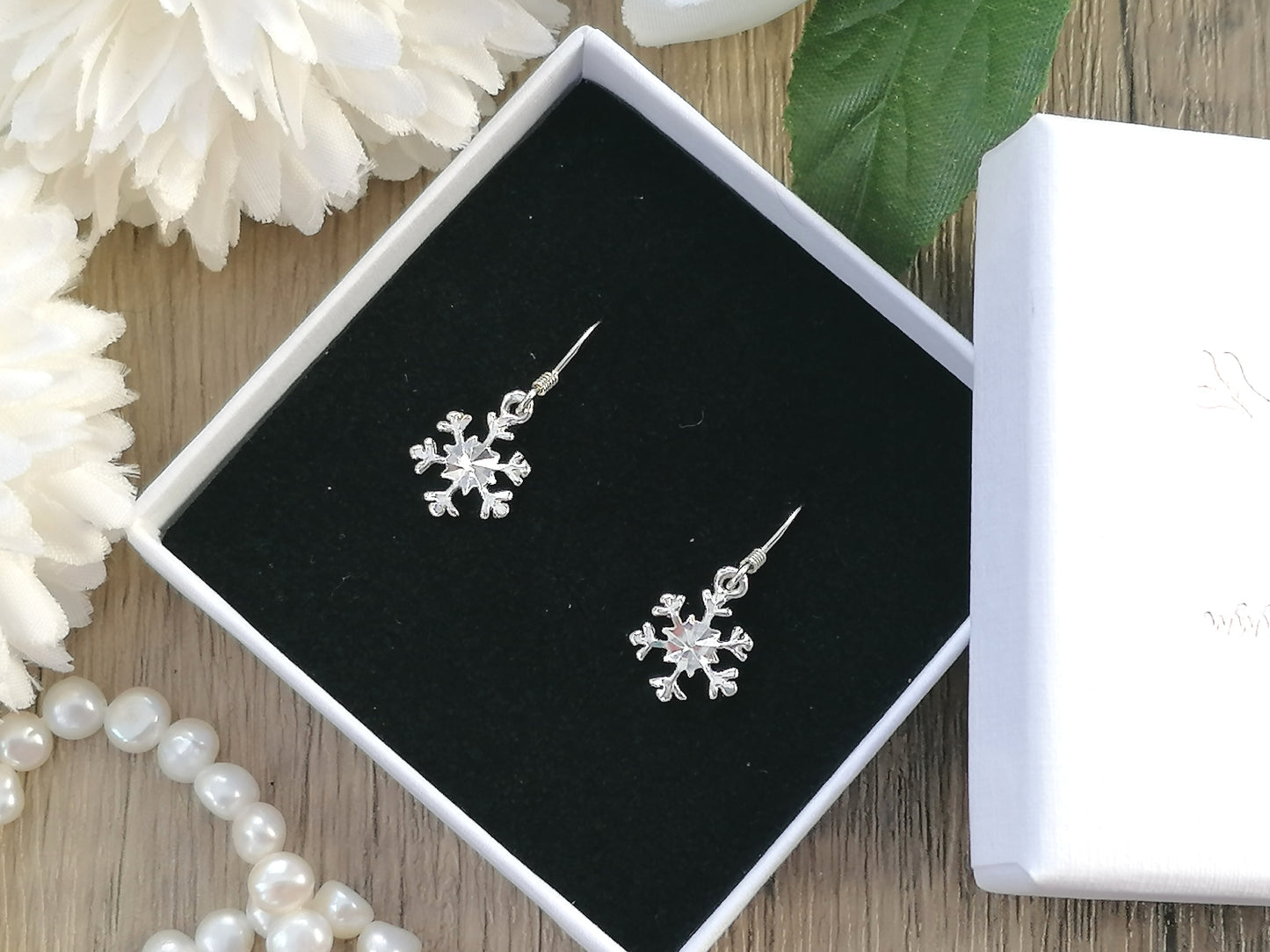 Sterling silver snowflake earrings.