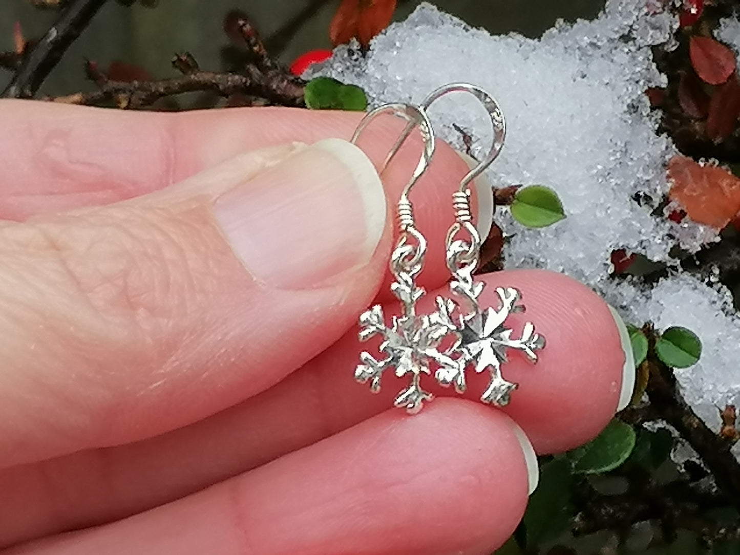 Sterling silver snowflake earrings.