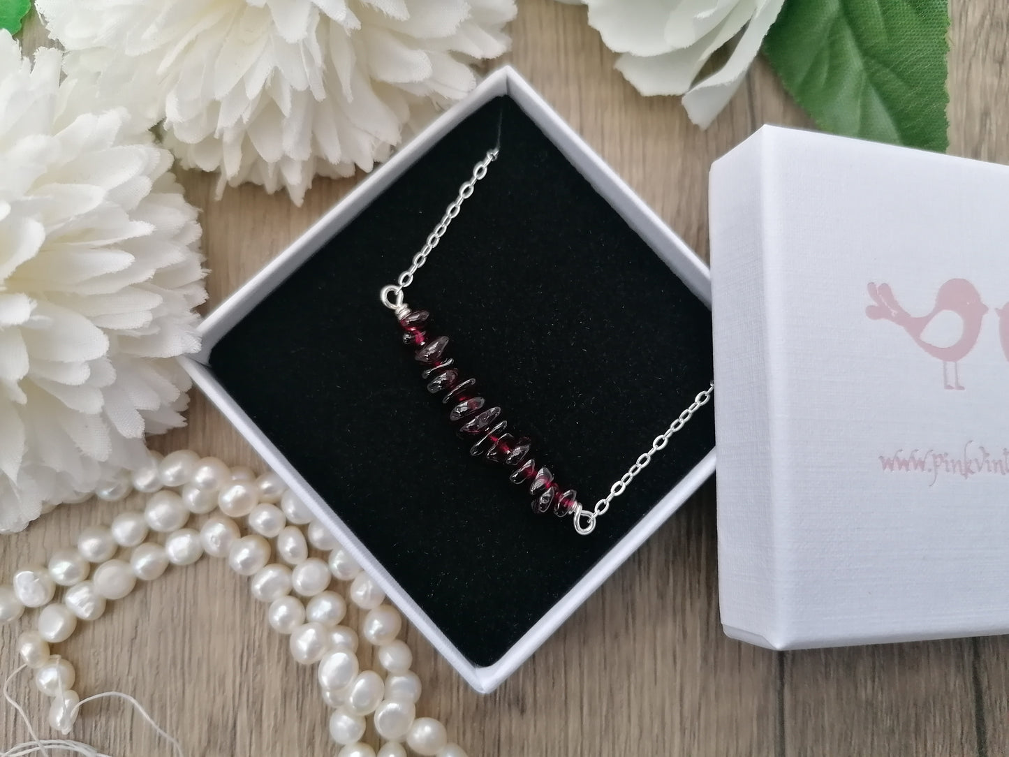 Garnet gemstone necklace in sterling silver.