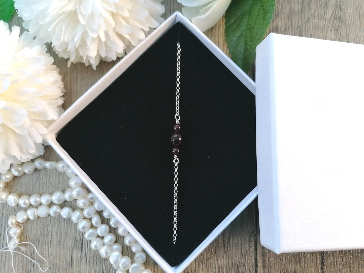 Garnet ankle bracelet in sterling silver.