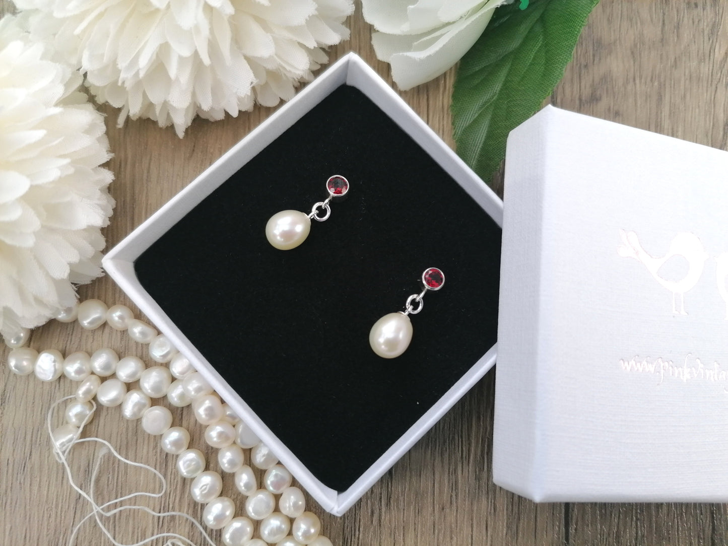 Garnet and pearl drop earrings.